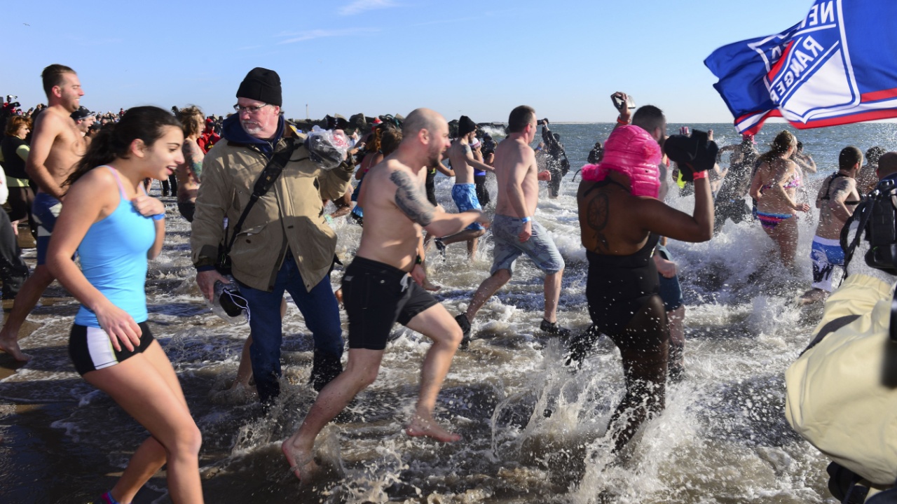 NEW YORK CITY - JANUARY 1 2014: several hundred people took part in the 9th annual Polar Bear Plunge in Coney Island, Brooklyn, to raise funds for Camp Sunshine