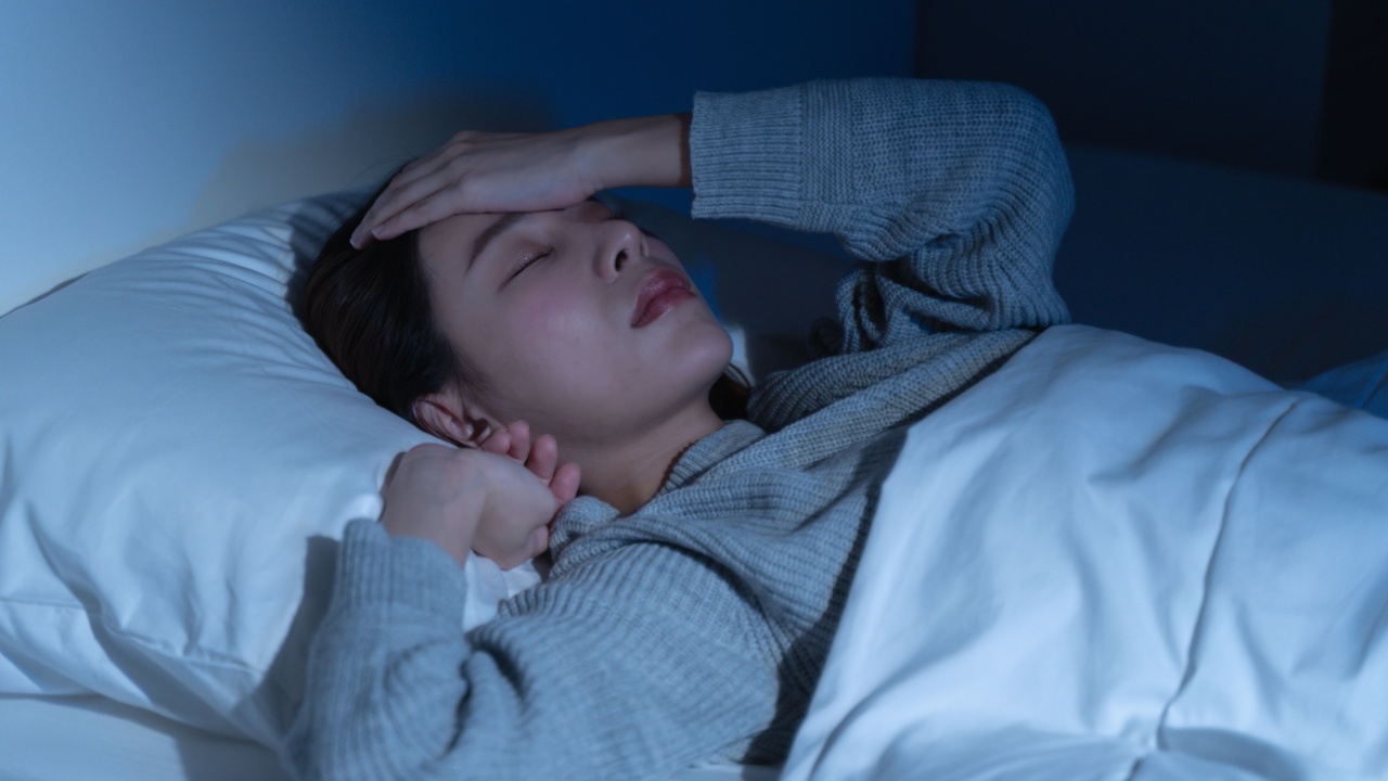 Anxiety disorder on insomnia woman concept, sleepless Woman open eye awakening on the bed at night time can't sleep from symptom of depression diseased.