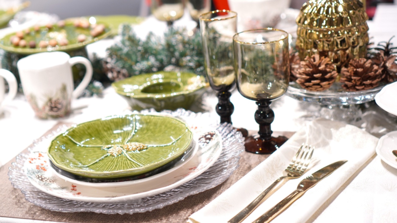 bright festive table setting for the New Year and Christmas with the help of glassware, ceramic products and linen tablecloth. High quality photo