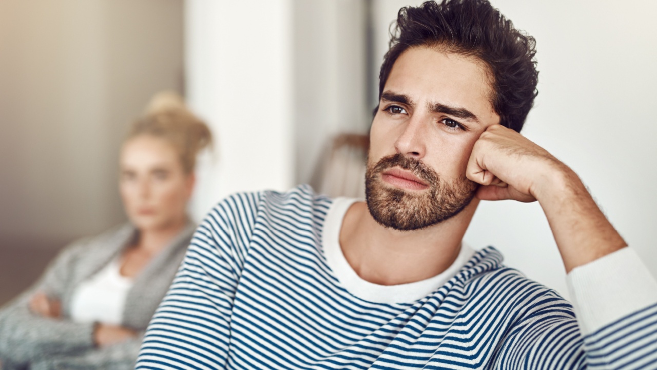 Man, silent and couple ignore in home, disagreement and betrayal or abuse in toxic marriage. People, drama and relationship mistake or fail in living room, divorce and stubborn fighting on sofa