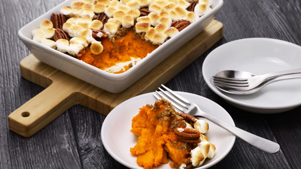 sweet potato casserole with marshmallows and pecans. American thanksgiving dinner side dish.