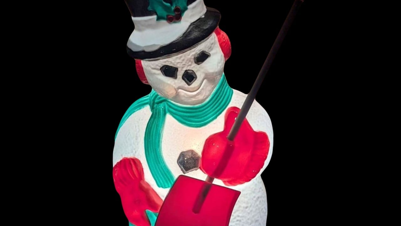 Vintage snowman Christmas blow mold on a green screen film effect