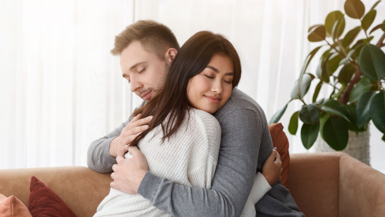 Reconciliation Concept. Multicultural Couple Hugging Supporting Each Other Or Reconciling After Quarrel At Home