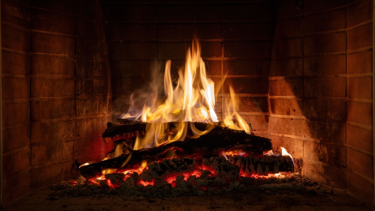 Fire flames, wood logs burning in fireplace. Warm home in winter, heat. Christmas holiday