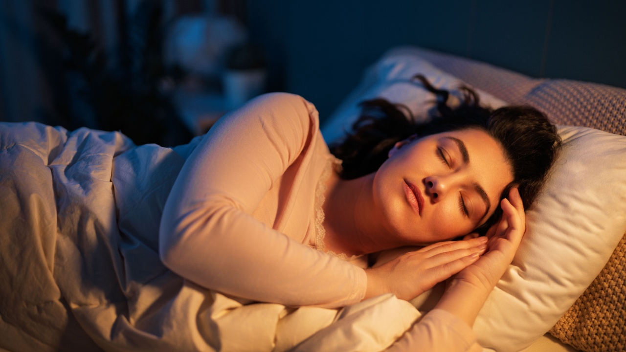 Woman is sleeping peacefully in her bedroom at night.