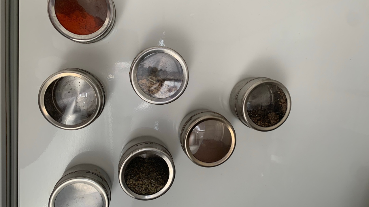 jars of spices on the wall of the refrigerator
