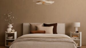 Minimalist bedroom with pendant light, white nightstands and neutral bedding.