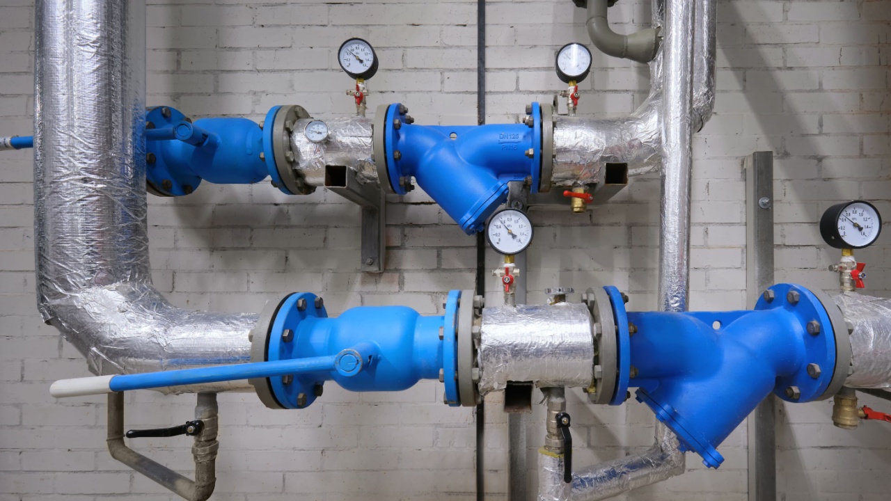 Water supply system in the basement of the house. Shut-off valves and pressure gauges for monitoring water pressure in main pipes.