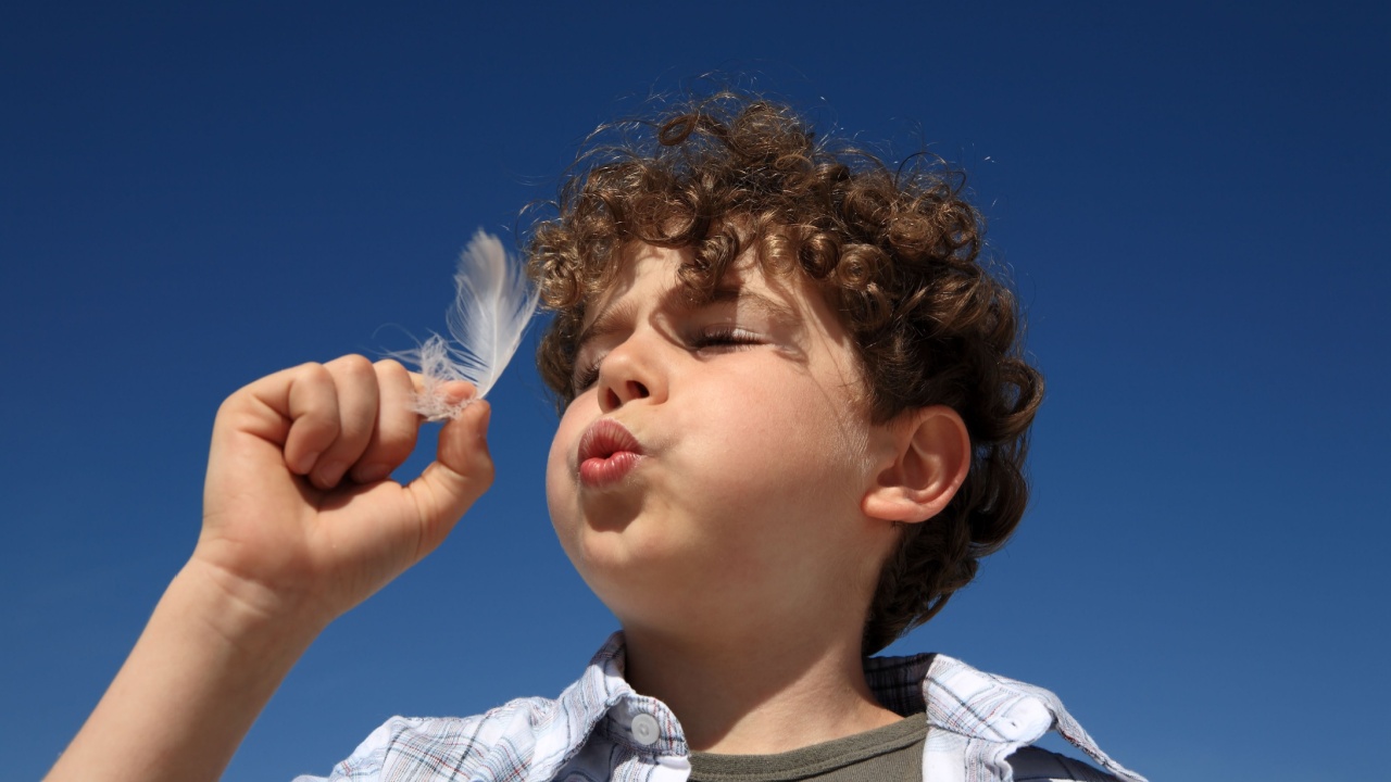 Boy blowing
