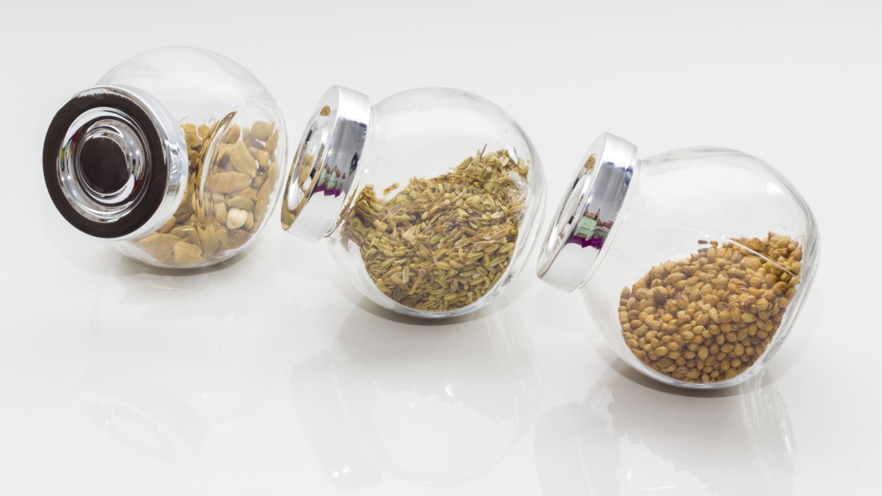 Dried spices and herbs variety over white background