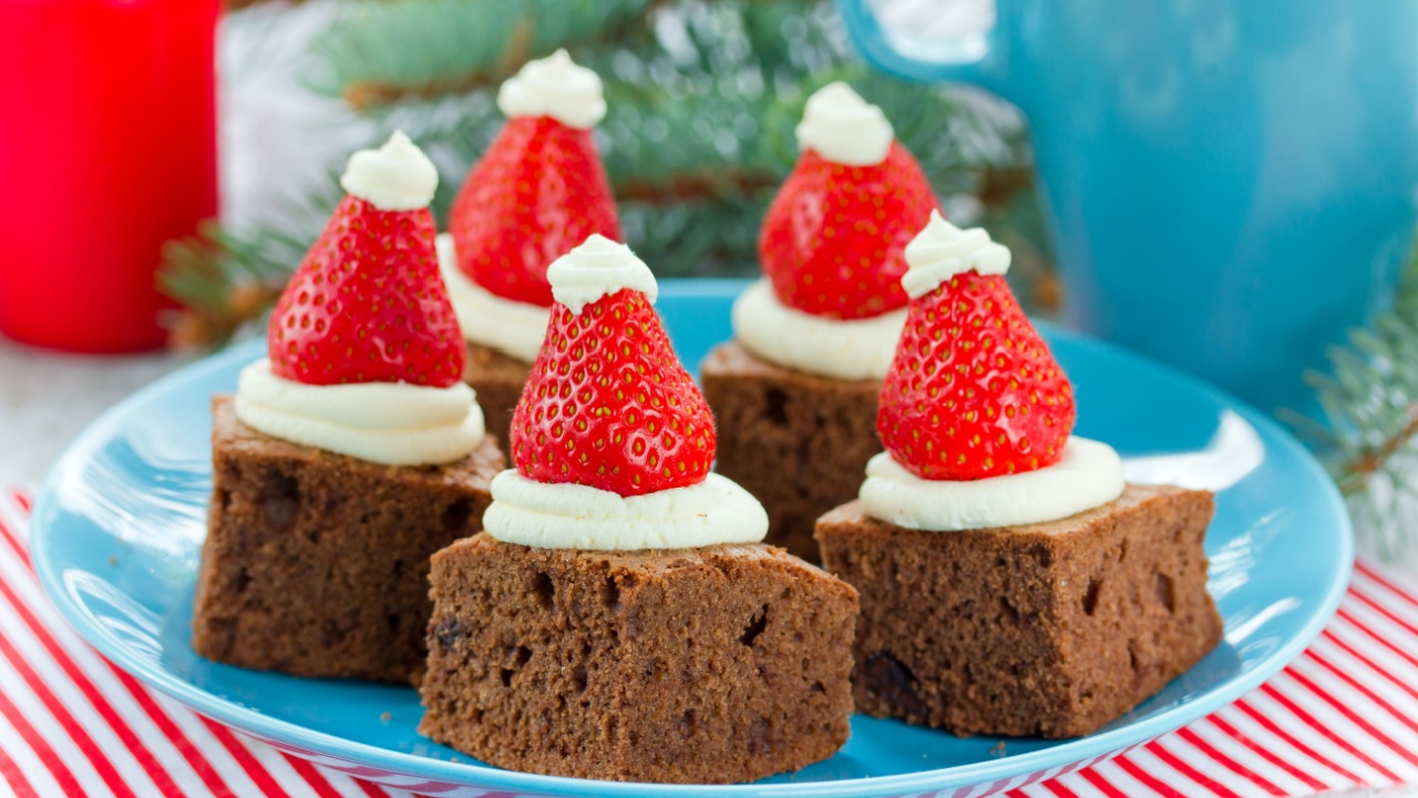 Christmas Santa hat brownies dessert idea , cake brownie with cream and strawberry , Christmas and New Year holiday dessert food