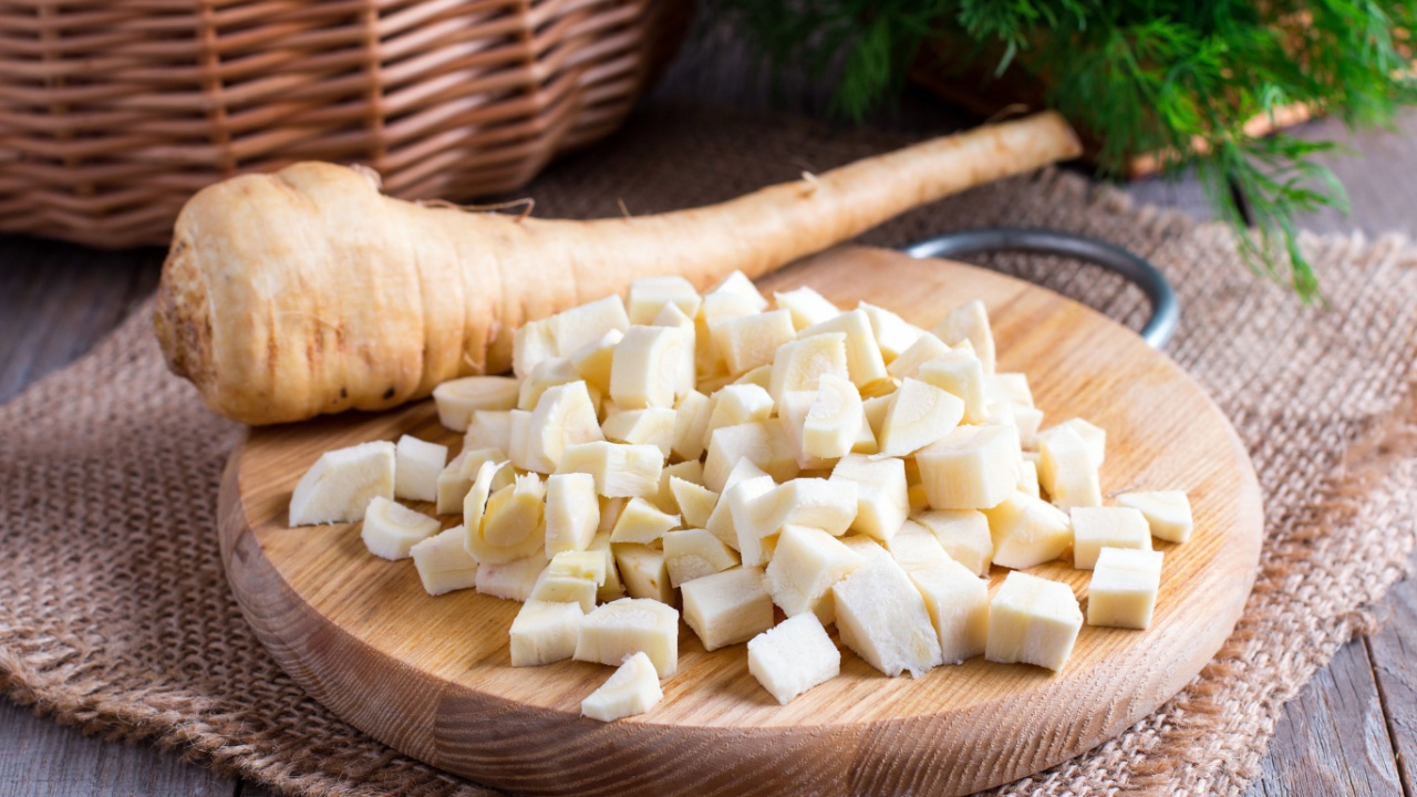 Fresh sliced parsnips on a wooden board