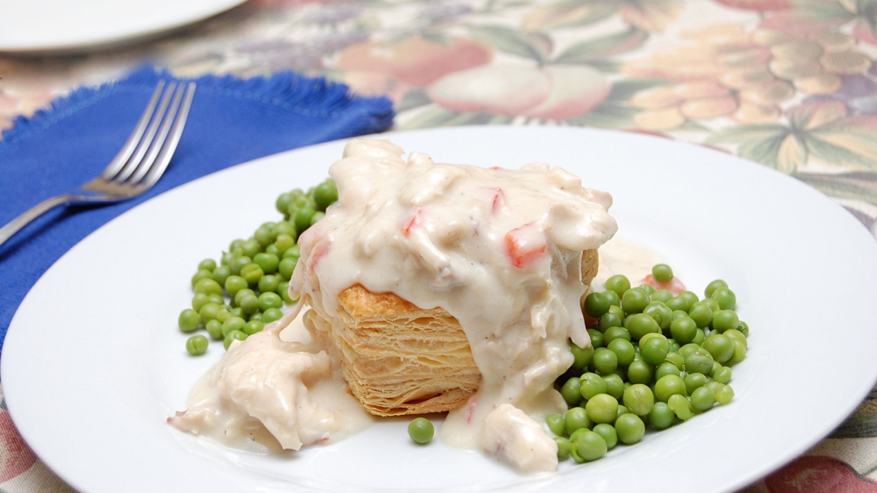 A Delicious Meal of Chicken A La King Served on a Flaky Pastry, Vol Au Vent with Green Peas and Cream Sauce