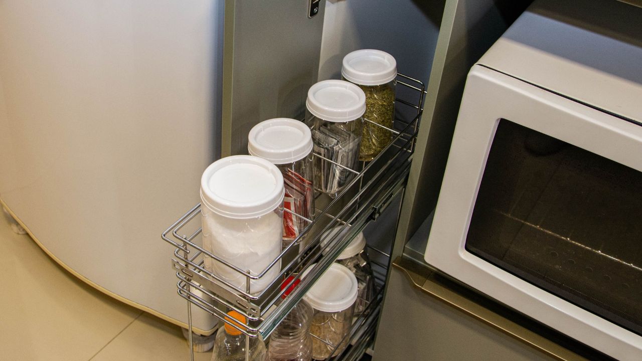 Spice holder built into kitchen furniture. Spice rack or storage cabinet. Kitchen holder, decoration and organization of the seasonings.