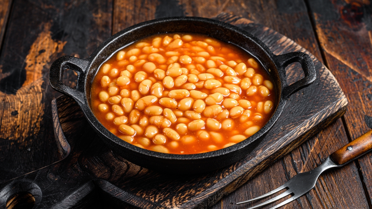 an iron skillet with baked beans
