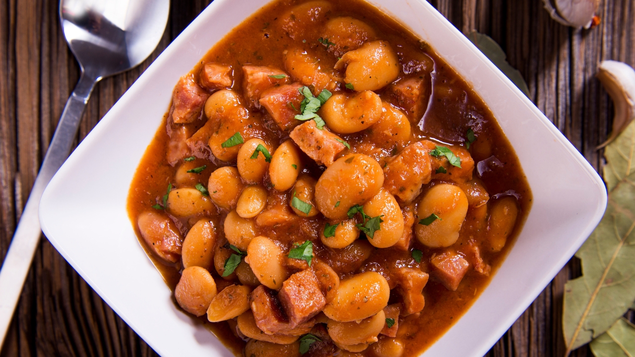 a dish of beans and hot dogs