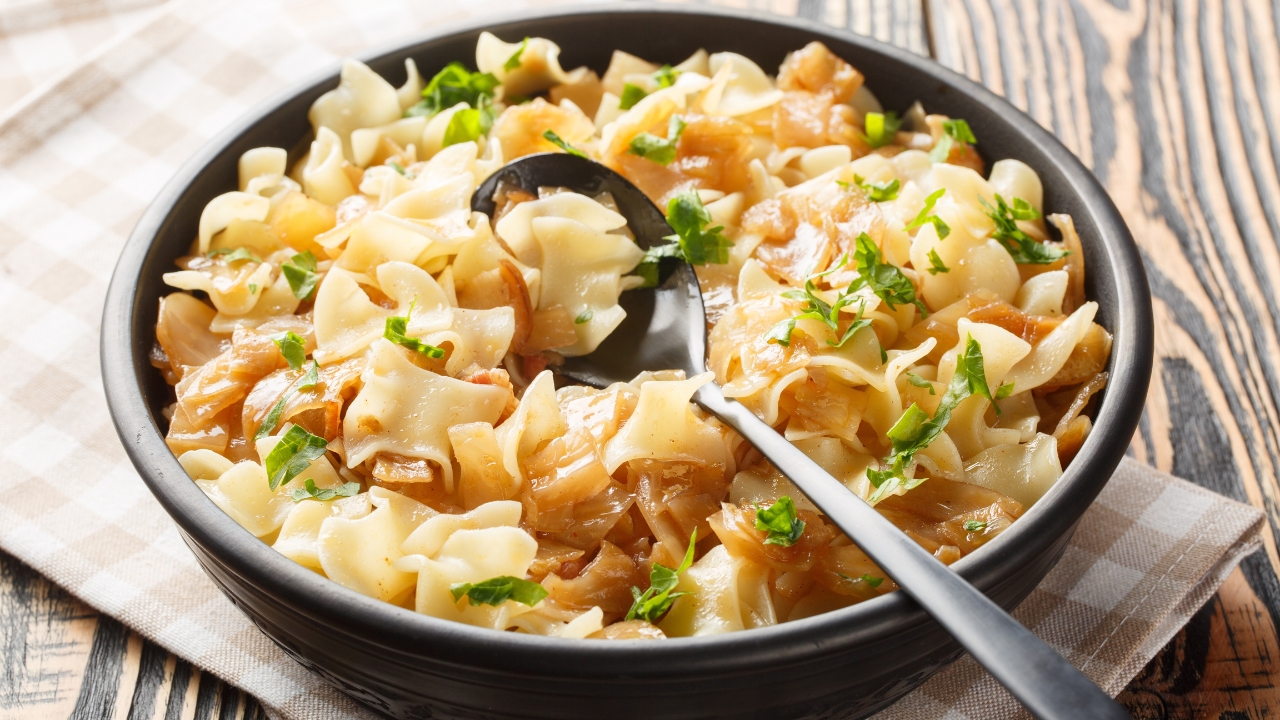 a dish of cabbage and noodles