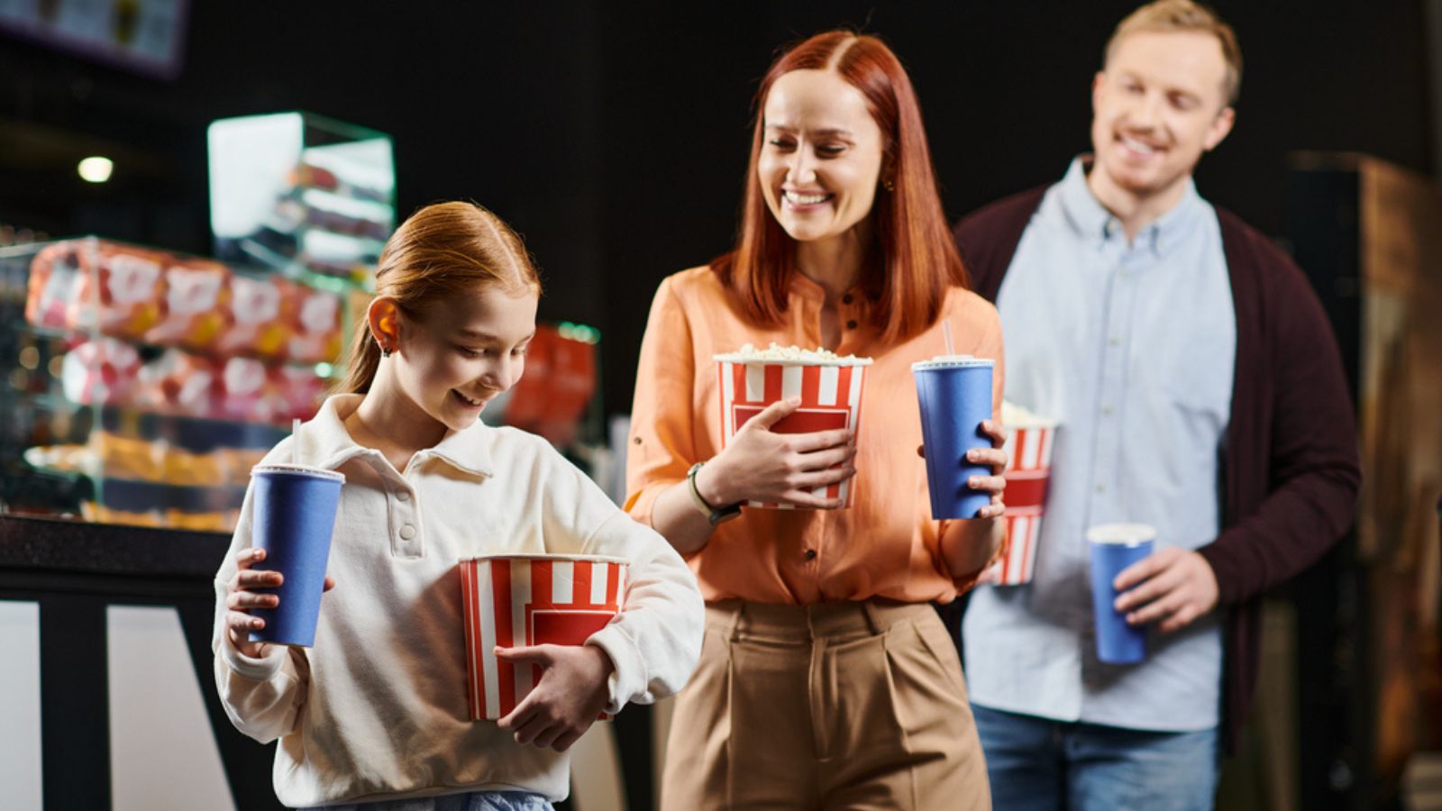 family at the movie theater snacks popcorn