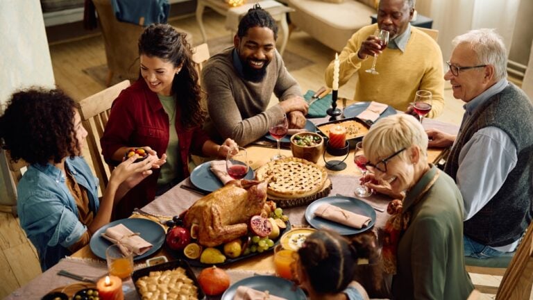 a family is gathered around a dinner table