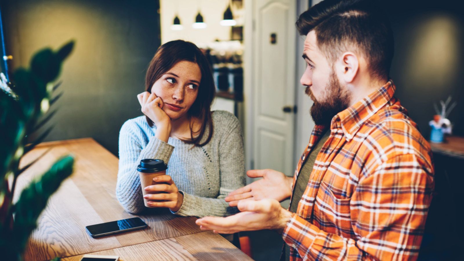 friend-annoyed-at-man-coffee-shop-conversation-jerk