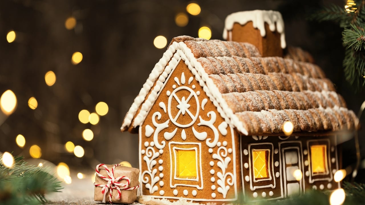 a beautiful gingerbread house, decorated with white icing