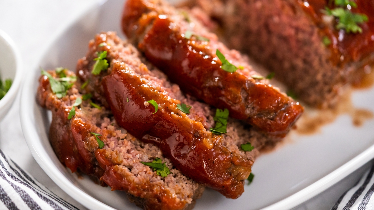a platter with sliced meatloaf