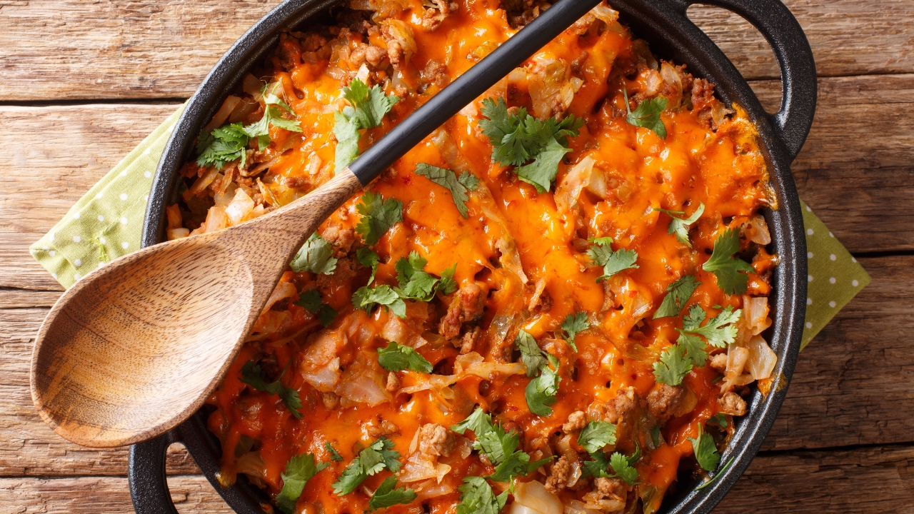 a cabbage and ground beef casserole in an iron skillet
