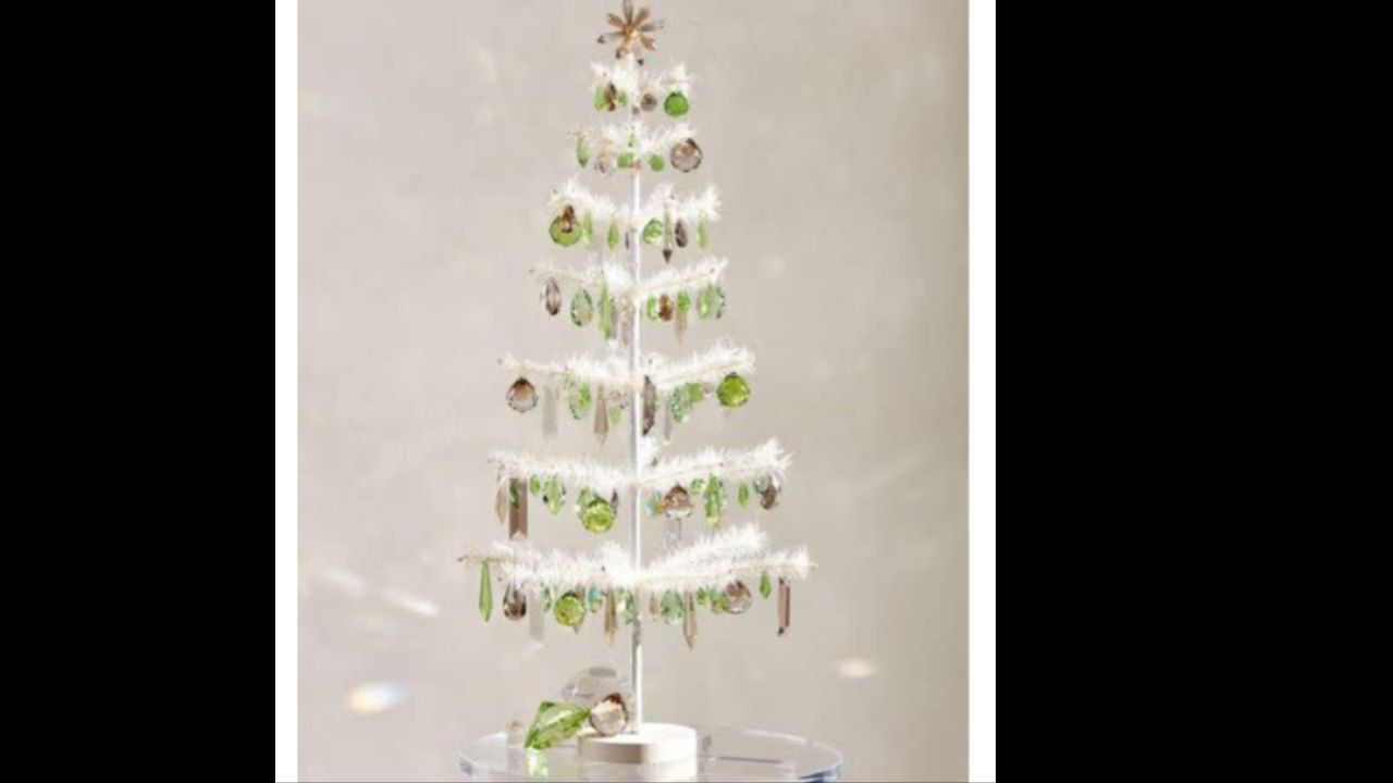 A reproduction of a Victorian feather tree. Originally made of goose feathers, unknown what this one is made from. Branches are painted a light green.