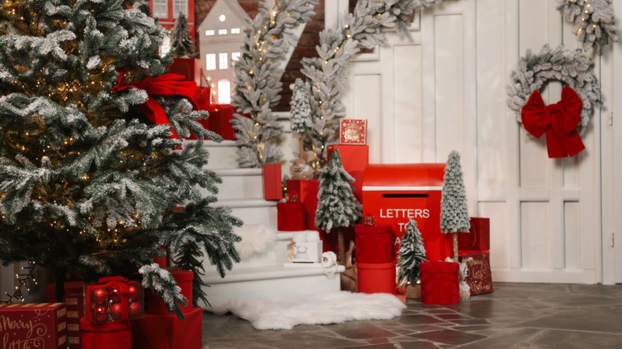 Christmas tree, gift boxes and festive decor indoors. Interior design