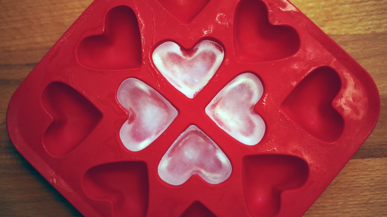 Four heart shaped red ice on the mold