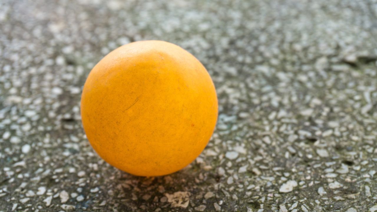 Orange ping pong on the floor