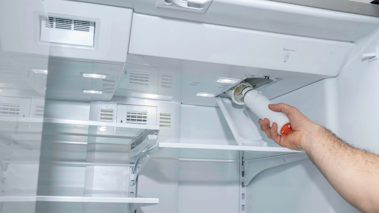 Removing a refrigerator water filter in a modern appliance