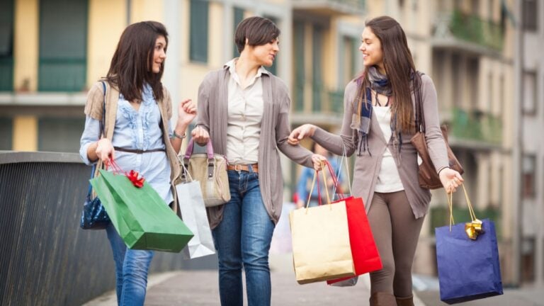 Three Beautiful Young Women with Shopping Bags
