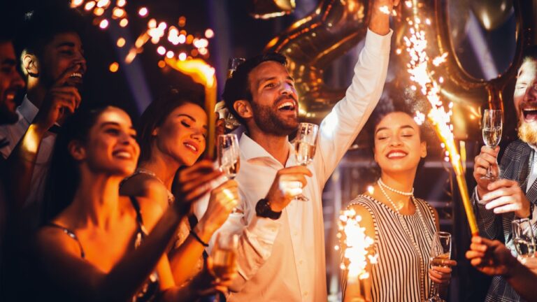 Group of friends celebrating with champagne