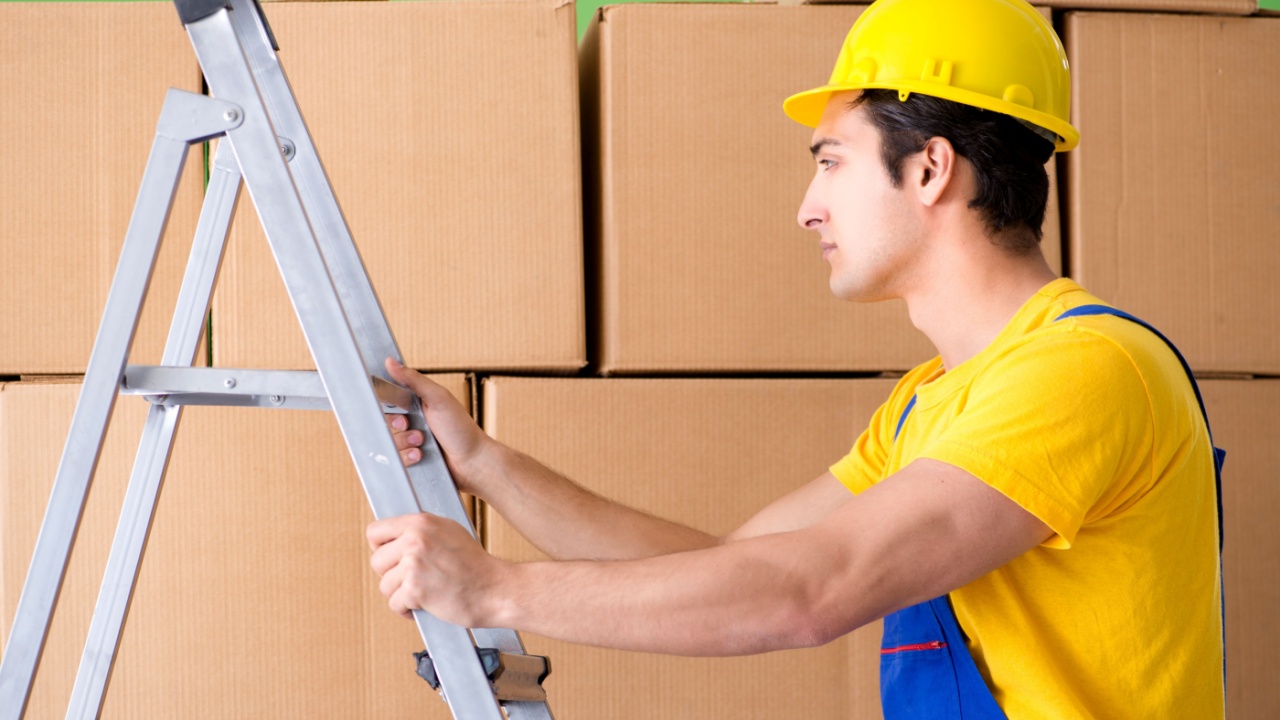 Man contractor working with boxes delivery