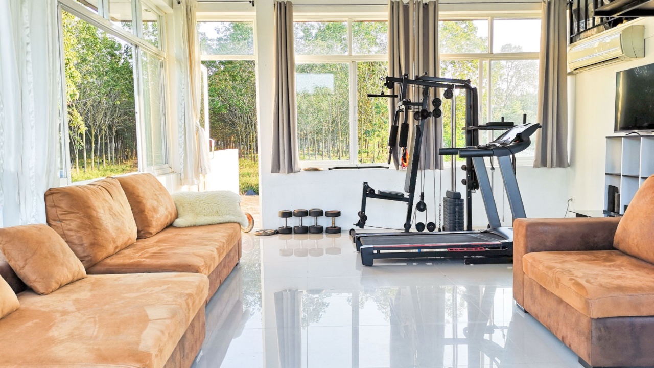 Home gym. Private gym at home, luxury, Small home gym With bench With dumbbells, Interior of New modern Equipment, apartment, different exercise Equipments