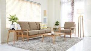 Scandinavian style livingroom with fabric sofa, sofa table. morning image with plant. sofa table on the lug.
