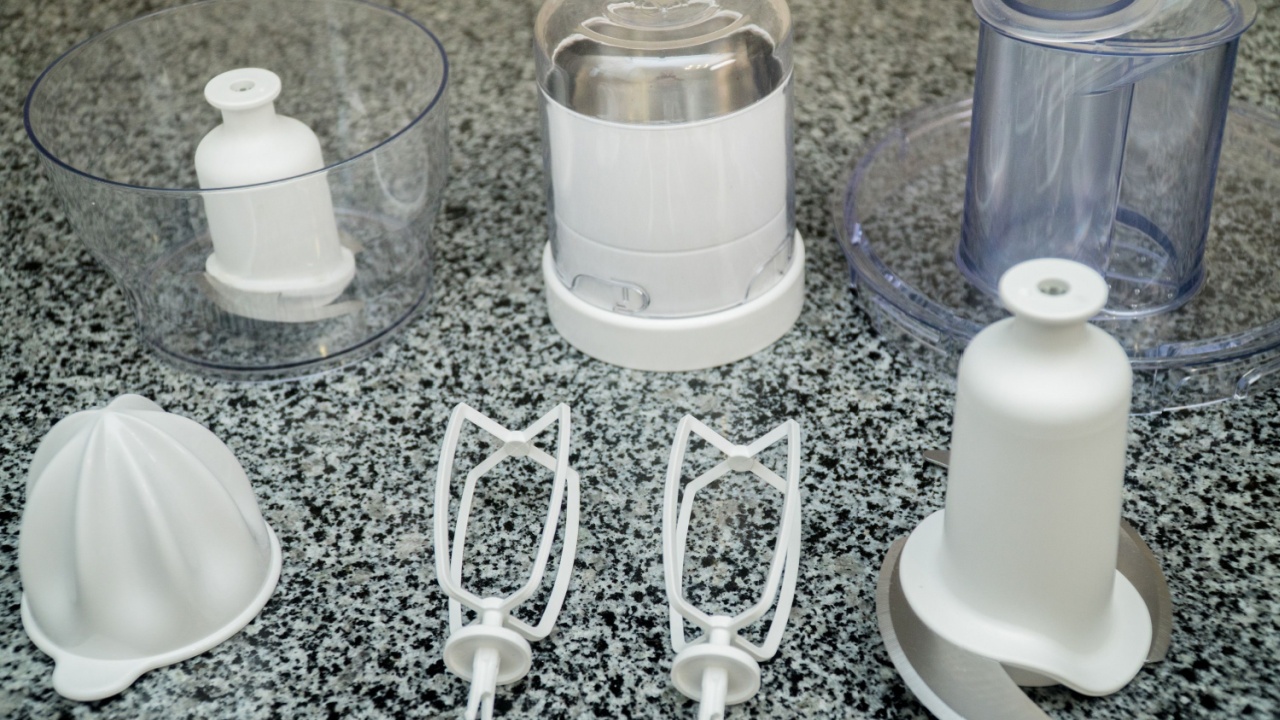 disassembled multifunctional food processor on kitchen countertops. Smoothie Maker. Electric Kitchen and Household Domestic Appliance