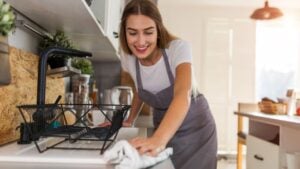 Woman Cleaning Kitchen Counter