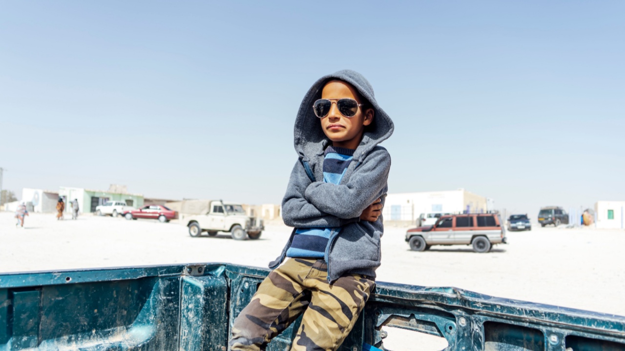 African boy climbed in a van