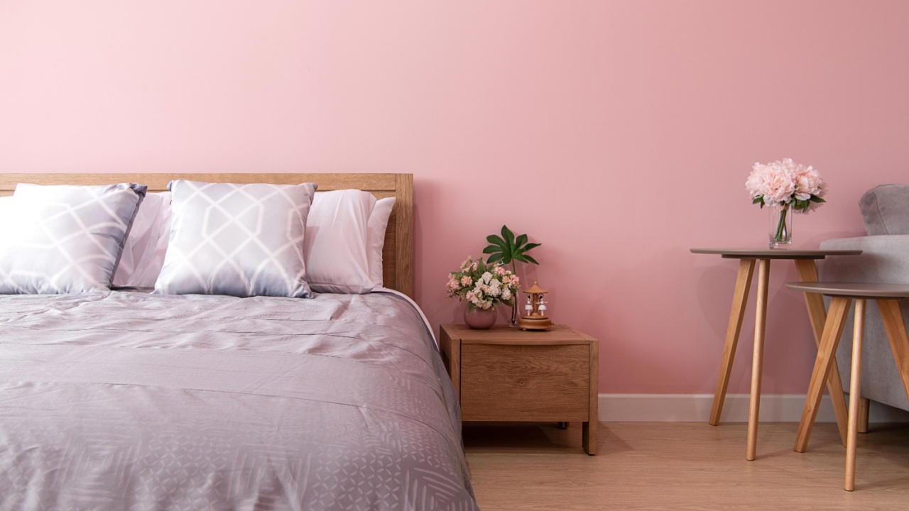 bedroom Interior of room with comfortable bed near pink wall