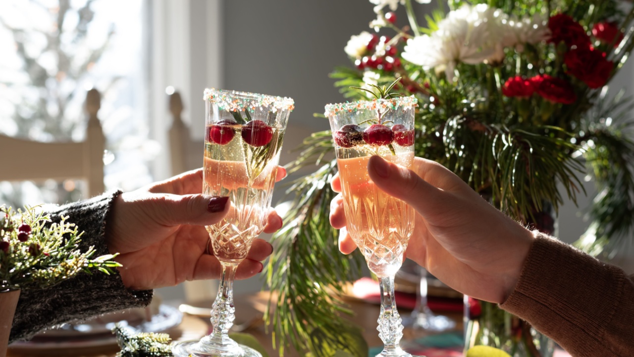 Holiday toast with festive champagne cocktails