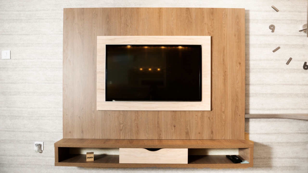 Smart TV in a wooden wall in a cozy apartment