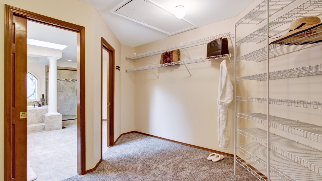 Empty living room interior in luxury house with french windows and fireplace. Panoramic view from upstairs hallway
