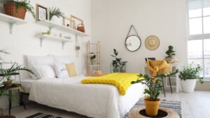 Stylish interior of modern bedroom with houseplants