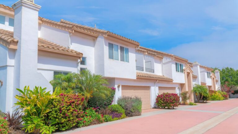 White townhouses exterior with landscape garden at the front at Carlsbad, San Diego, California