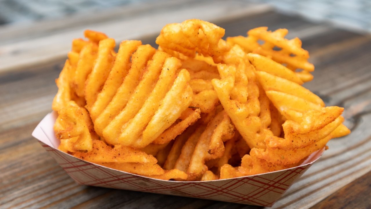 Waffle Fries in a Disposable Container on a Table