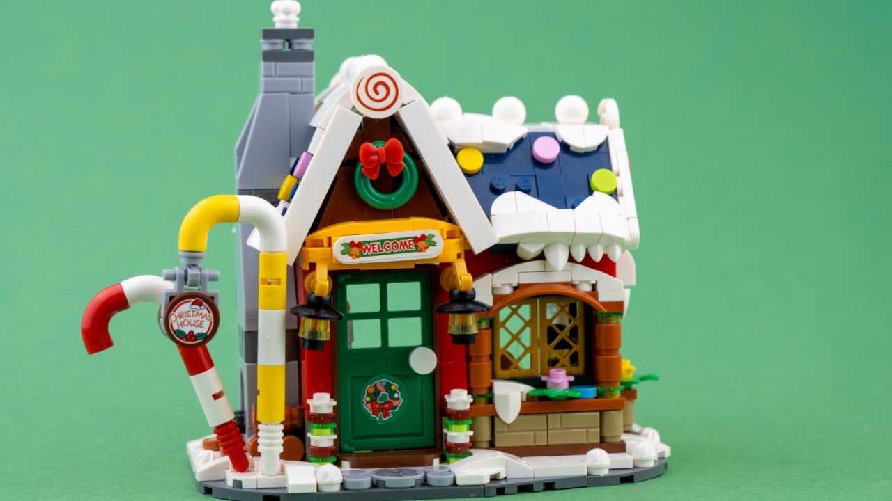 New Year's toy. Winter house of Santa Claus. Lego constructor bricks details. Christmas story and minifigures. Children's craft concept background. Kyiv, Ukraine - February 23, 2022