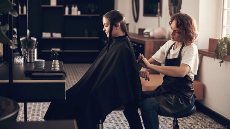 She always do a good job with my hair. Shot of a hairstylist cutting a clients hair in a salon.