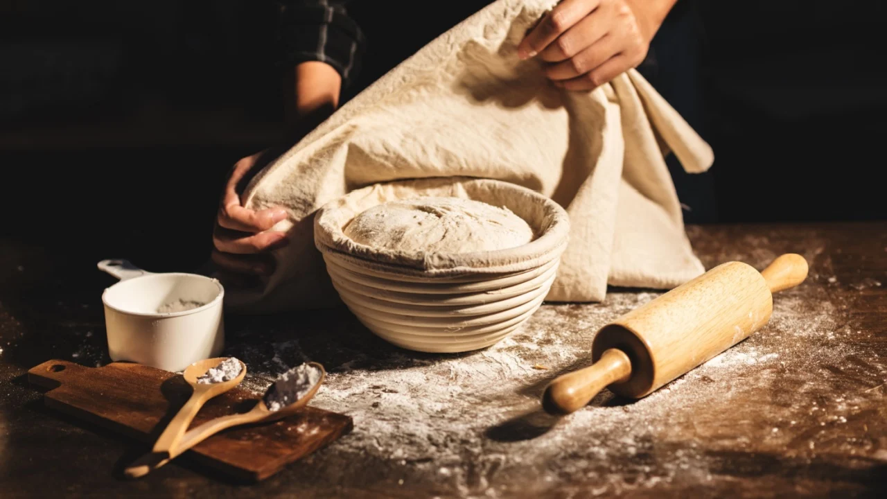 Still life photo of bakers prepare the dough for the bread such as sourdough or artisan bread on the table in the kitchen.
